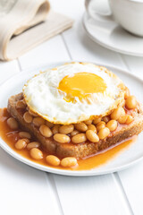 Toast with fried egg and baked beans.