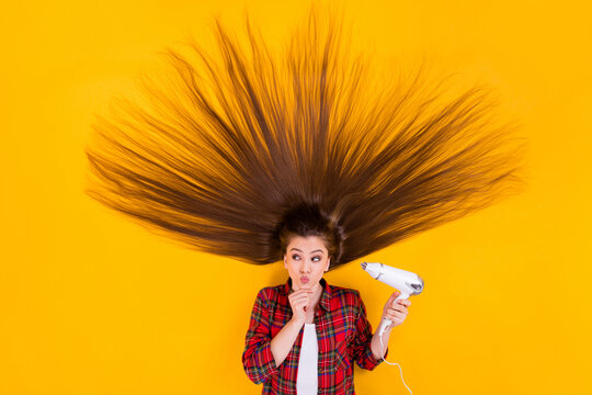 Top view above high angle flat lay flatlay lie concept of her she nice pretty curious cheery long-haired girl using hot warm air drier isolated on bright vivid shine vibrant yellow color background