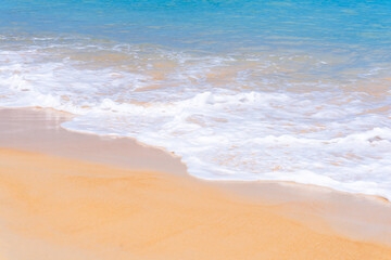 Fototapeta na wymiar Close up beautiful sea wave on tropical sand beach in summer background
