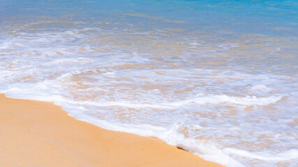 Close up beautiful sea wave on tropical sand beach in summer background