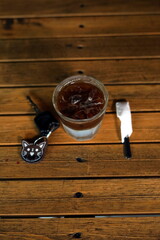 Coffee and Car Key on a wooden table