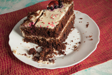 Sponge cake with cream on a white plate.