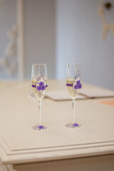 wedding glasses of newlyweds with champagne