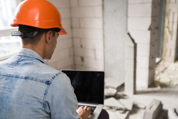 architecture and home renovation concept - foreman for renovation in the apartment