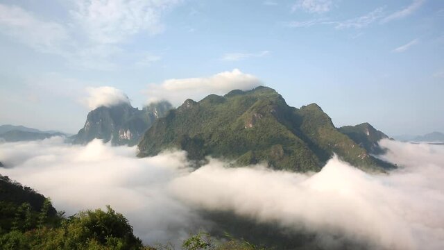 Tropical mountain over a valley filled with clouds - Nong Khiaw, Laos