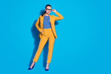 Full length photo of attractive business lady successful worker hold hand vision reading spectacles wear yellow blazer suit dotted blouse shirt isolated bright blue color background
