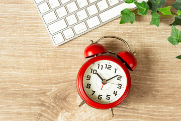 Computer and alarm clock. Work hours, working hours, telework, business, job changes, etc....