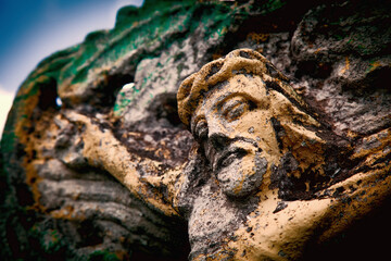 Close up ancient statue: the crucifixion of Jesus Christ as a symbol of God's love