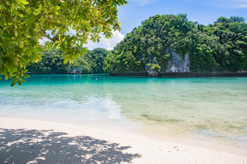 Calm Ocean, Shallow water, Lagoon, Green hills and Beach view of Omekang Island, Rock Island Southern Lagoon, Palau, Pacific, UNESC world heritage site