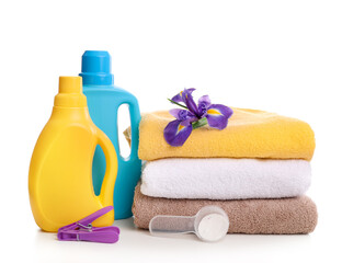 Detergent with washing powder and towels isolated on white