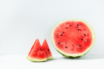 Slices of sliced ripe, juicy, sweet watermelon on a light background front view. The concept of light, summer food.