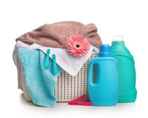 Detergent with washing powder and towels isolated on white