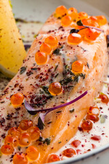 Festive dish salmon with roe lemon and broccoli