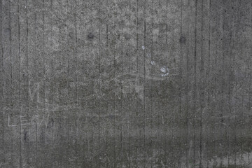 old gray scratched surface of cement wall with vertical lines and rough texture