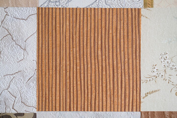 Part of the old wallpaper. Square wallpaper on the wall. Background