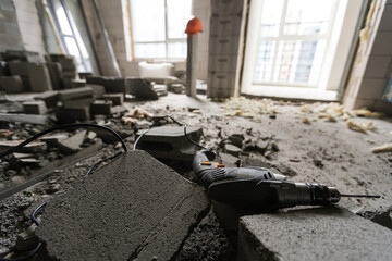 Wall smashed into debris room in apartment ready for renovation with destroyed smashed wall demolish