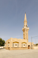 Mosque with minaret in a small place in Saudi Arabia.