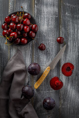 still life with cherries on a wooden table