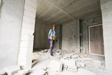 architecture and home renovation concept - foreman for renovation in the apartment