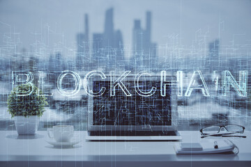 Double exposure of blockchain and crypto economy theme hologram and table with computer background....
