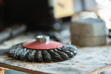 Grinding disc for metal on the workbench close up background.