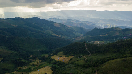 Obraz premium Picture aerial view of sunbeam over mountain, Nature Background