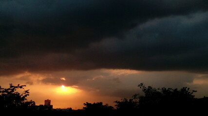 cloudy silhouette sunset over the city 