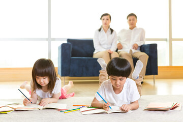 Happy family drawing pictures at home