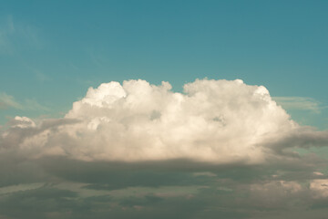 Fototapeta premium A large white cloud against the blue sky.