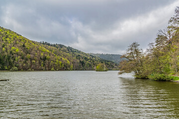 Beautiful picturesque volcanic lake in Volcans d'Auvergne regional natural park. Monts Dore Mountains, Auvergne, France.