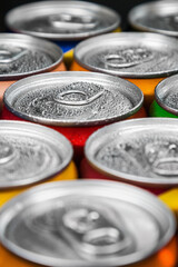 aluminum cans with carbonated water, energy drinks or beer. Background of aluminum cans