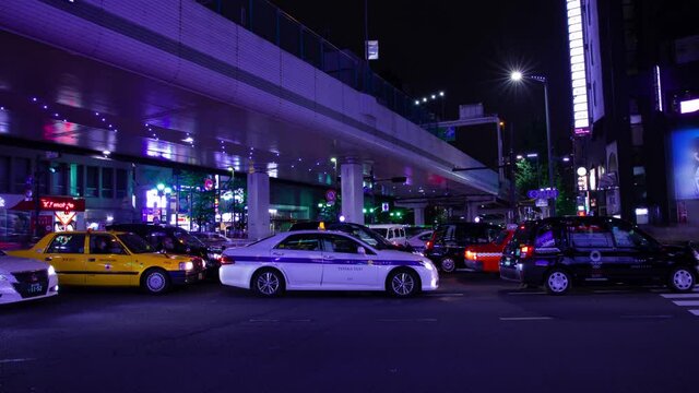 A night motion timelapse of the neon street in Roppongi Tokyo wide shot