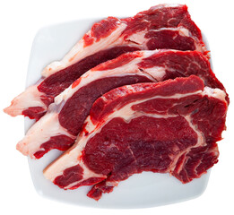 Ingredients for cooking. Raw beef entrecotes. Isolated over white background