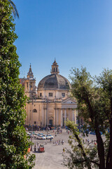 Fototapeta na wymiar ROME, ITALY - 2014 AUGUST 18. Piazza del Popolo in central Rome with the twin sister church in behind.
