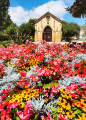 Santa Ana church in Getxo with colorful flowers