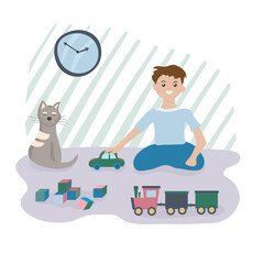 The boy plays at home with toys and cars, next to his favorite pet - striped cat. Time for rest and self-development . Concept of family values.