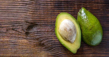 Avocado on old wooden table.healthy food concept