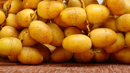  fresh Date Palm on a wooden background, copy space