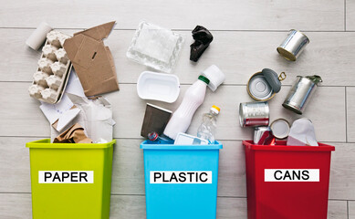 Three different container for sorting garbage. For plastic, paper, metal