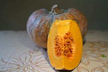 A piece of ripe pumpkin cut from a fruit.