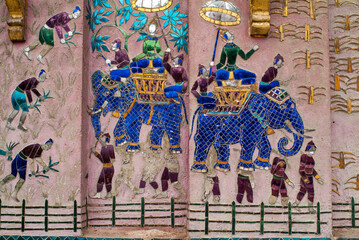 Colorful glass mosaics at the back of Vat Xieng Thong Pagoda in Luang Prabang, Laos