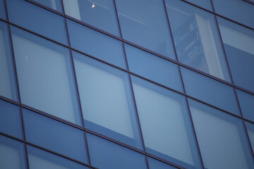 facia of modern office building with glass 