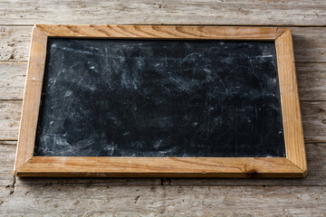 Blackboard on wooden background with copy space