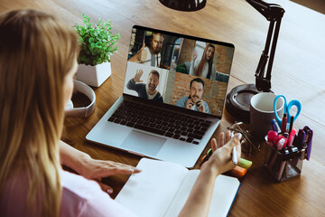 Remote meeting. Woman working from home during coronavirus or COVID-19 quarantine, remote office...