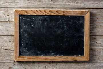 Blackboard on wooden background with copy space