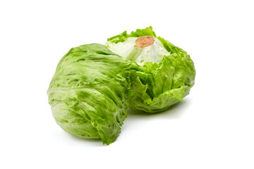 Iceberg lettuce isolated on white background. Two whole heads of crisphead lettuce, leafy green vegetables