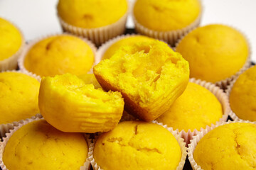Vegetable cupcakes, closeup. Half of yellow pumpkin muffin, selective focus. Homemade bakery