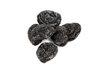 Prunes, dry plums isolated on white background. Heap of dried fruits