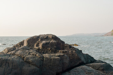beautiful sunset on the beachside over  the side rock