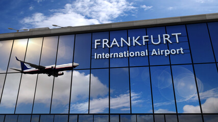Airplane landing at Frankfurt mirrored in terminal - obrazy, fototapety, plakaty